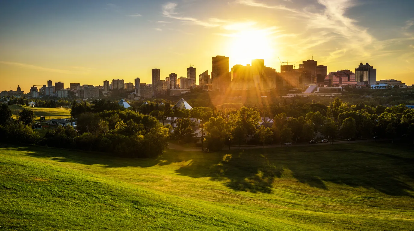 The Edmonton downtown skyline at sunset, seen from the river valley
